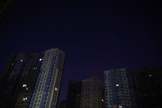 Apartment buildings without power during a blackout after critical civil infrastructure was hit by overnight Russian missile and drone strikes in Kyiv